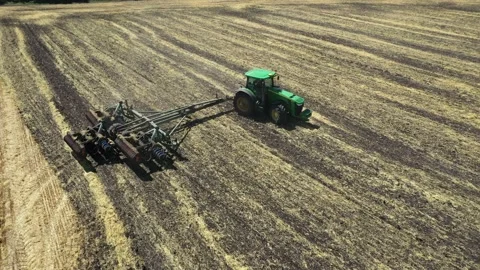 Tractor plowing the field top view aerial photography from a quadcopter Video stock 137006904