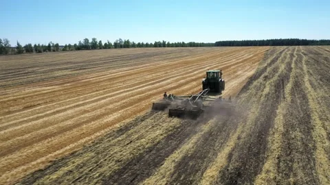 Tractor plowing the field top view aerial photography from a quadcopter Video stock 137007407
