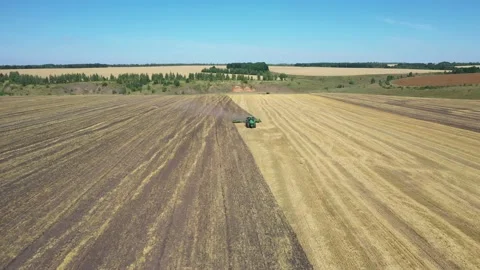 Tractor plowing the field top view aerial photography from a quadcopter Video stock 137007461
