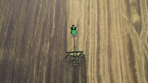 Tractor plowing the field top view aerial photography from a quadcopter Video stock 137010902