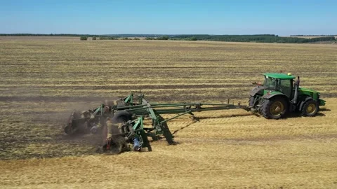 Tractor plowing the field top view aerial photography from a quadcopter Stock Footage 137010917