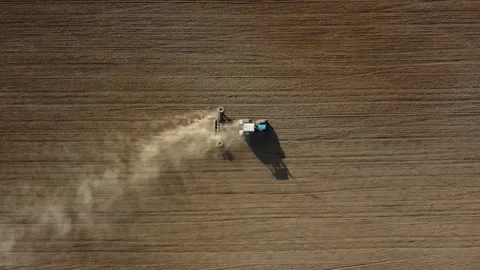 Tractor plowing field top view Stock Footage 201373559