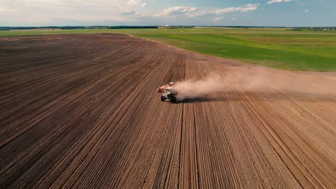 Tractor plowing field. Tractor plow soil cultivating. Sowing seeds 스톡 동영상 167563044