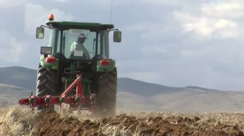 With tractor plowing fields Stock Footage 10905615