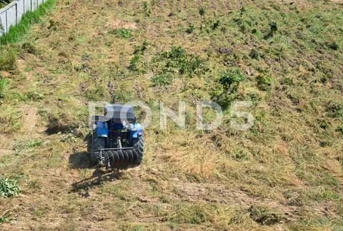 Tractor plowing the fields Stock Photos