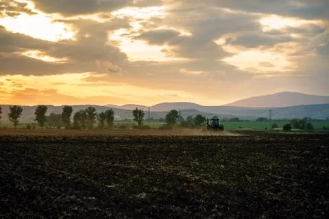 Tractor plowing fields. Stock Photos