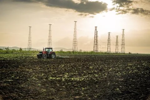 Tractor plowing fields. Stock Photos