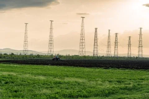 Tractor plowing fields. Stock Photos