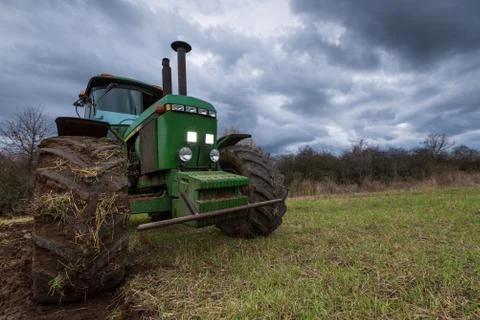 Tractor plowing fields. Stock Photos