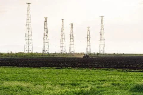 Tractor plowing fields. Stock Photos