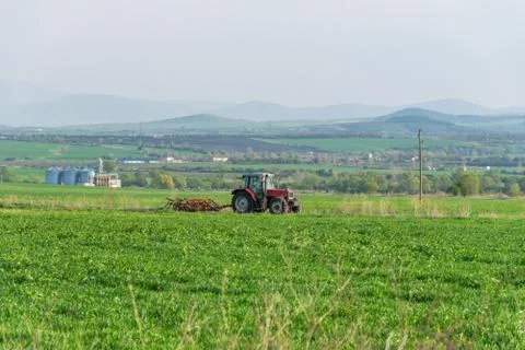 Tractor plowing fields. Stock Photos