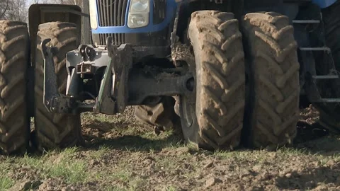 Tractor plowing fields -preparing land for sowing Stock Footage 119924358
