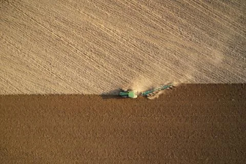 Tractor plowing fields -preparing land for sowing Stock Photos