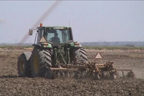 Tractor plowing Stock Footage 111556