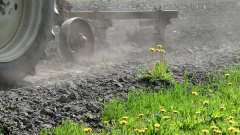 Tractor plowing the ground, close-up Stock Footage 108139238