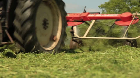 Tractor plowing hay Video stock 24633572