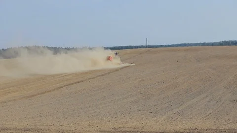 Tractor plowing land on field preparing soil for seeding or planting at spring. Video stock 124710496