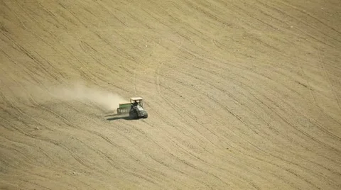 Tractor plowing land Stock Footage