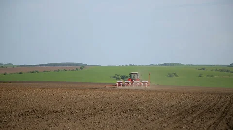 Tractor plowing the land Stock Footage 65876458
