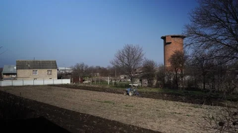 The tractor is plowing the land Stock Footage 151844539