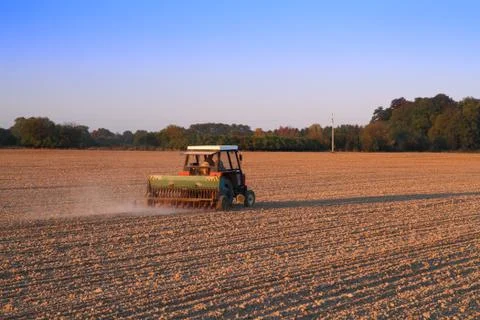 Tractor plowing Stock Photos