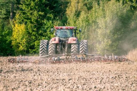 Tractor plowing Stock Photos