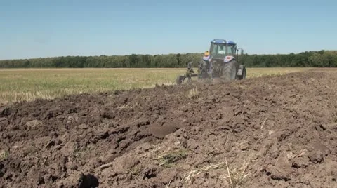 Tractor plowing, rear view 스톡 동영상 12153707