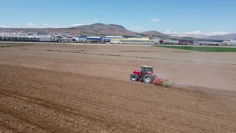 Tractor plowing soil in the field Stock Footage 237454233