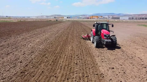 Tractor plowing soil in the field Stock Footage 237454680