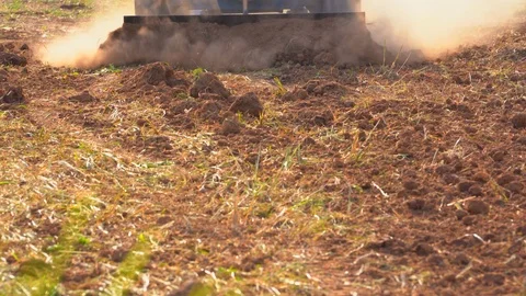 Tractor plowing soil grass filed farm agriculture for planting tree Stock Footage 106662268