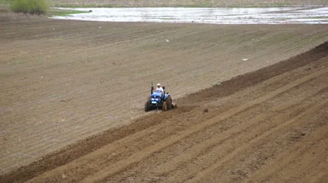 Tractor plowing the spring field (04) Stock Footage 23690062