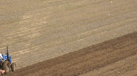 Tractor plowing the spring field (07) Stock Footage