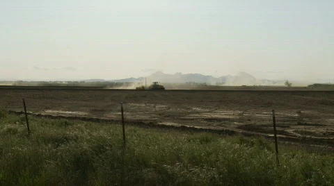 Tractor plowing in the valley Stock Footage 371523