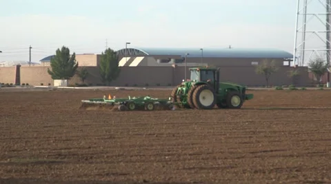 Tractor plows dirt field 02 Video stock 47682641