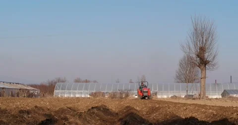 Tractor plows the field aerial. Stock Footage