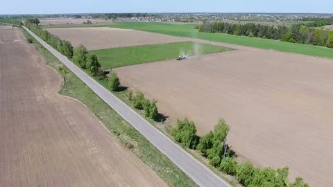 Tractor plows  field. Aerial view Stock Footage 75186717