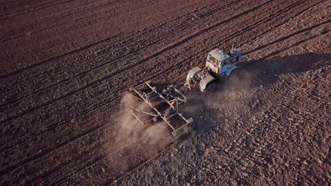 Tractor plows a field Stock Footage 131765031