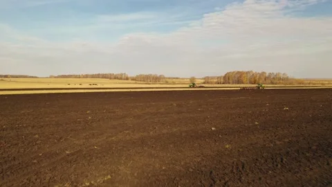 The tractor plows the field. Stock Footage 148038996