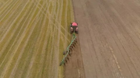 Tractor plows the field 스톡 동영상 148464568