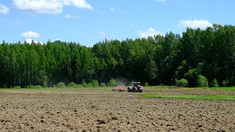 Tractor plows the field. Video stock 197441063