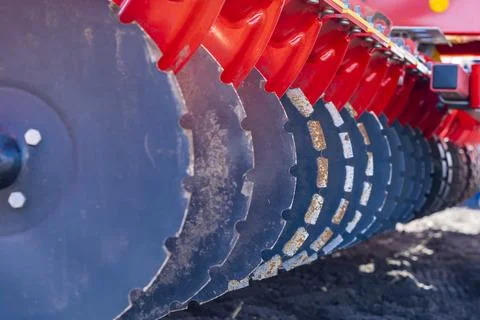 Tractor plows the field. Stock Photos
