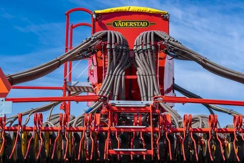 Tractor plows the field. Stock Photos