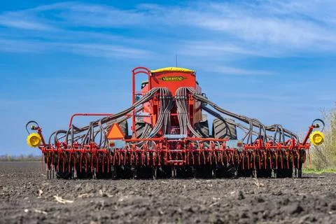 Tractor plows the field. Stock Photos