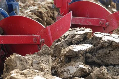 The tractor plows a field Stock Photos