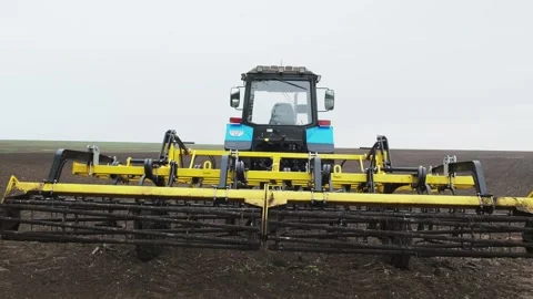 A tractor plows a field in the spring. Stock Footage 274160628