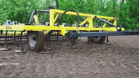 A tractor plows a field in the spring. Stock Footage 274161799