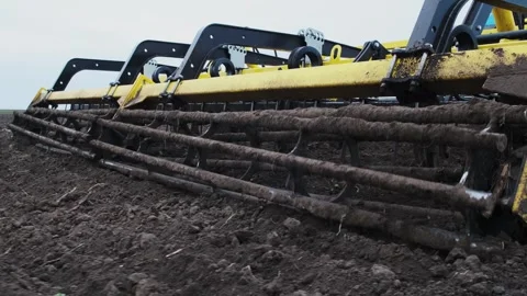 A tractor plows a field in the spring. Stock Footage 274162724