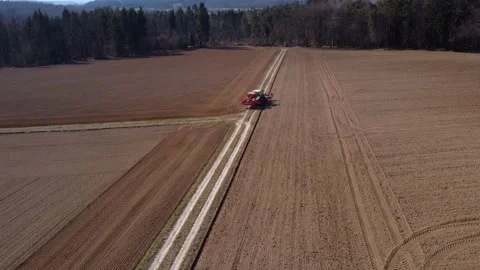 Tractor plows fields in Germany Stock Footage 172377008
