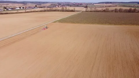 Tractor plows fields, top view Stock Footage 172378196