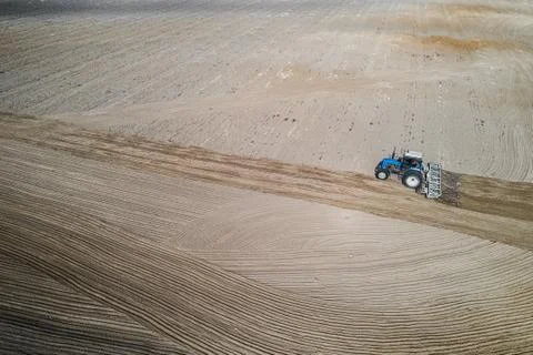 Tractor plows flight top view. Stock Photos